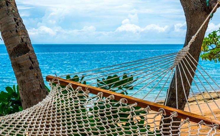 un hamac sur une plage des îles du Pacifique