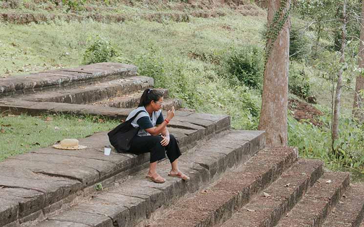 emmeli-m-cambodian with phone in the temples_0