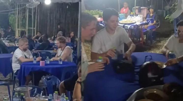 Touristes invités à manger dans un temple Thaïlande  