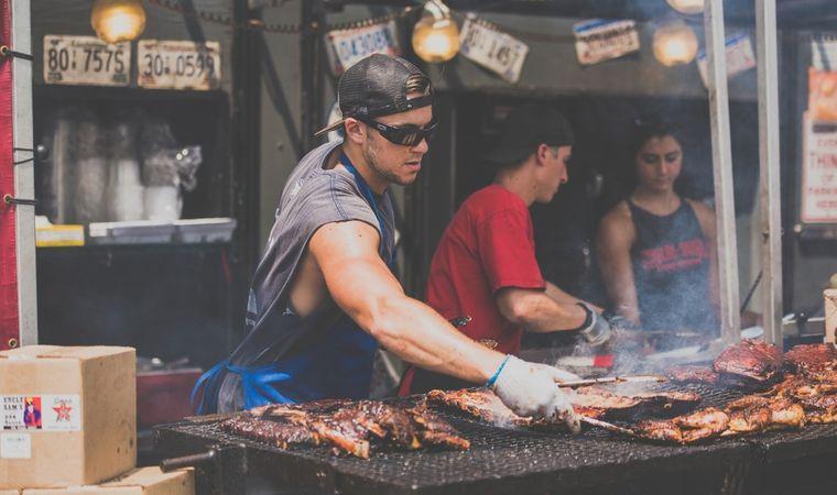 man cooking bbq ribs