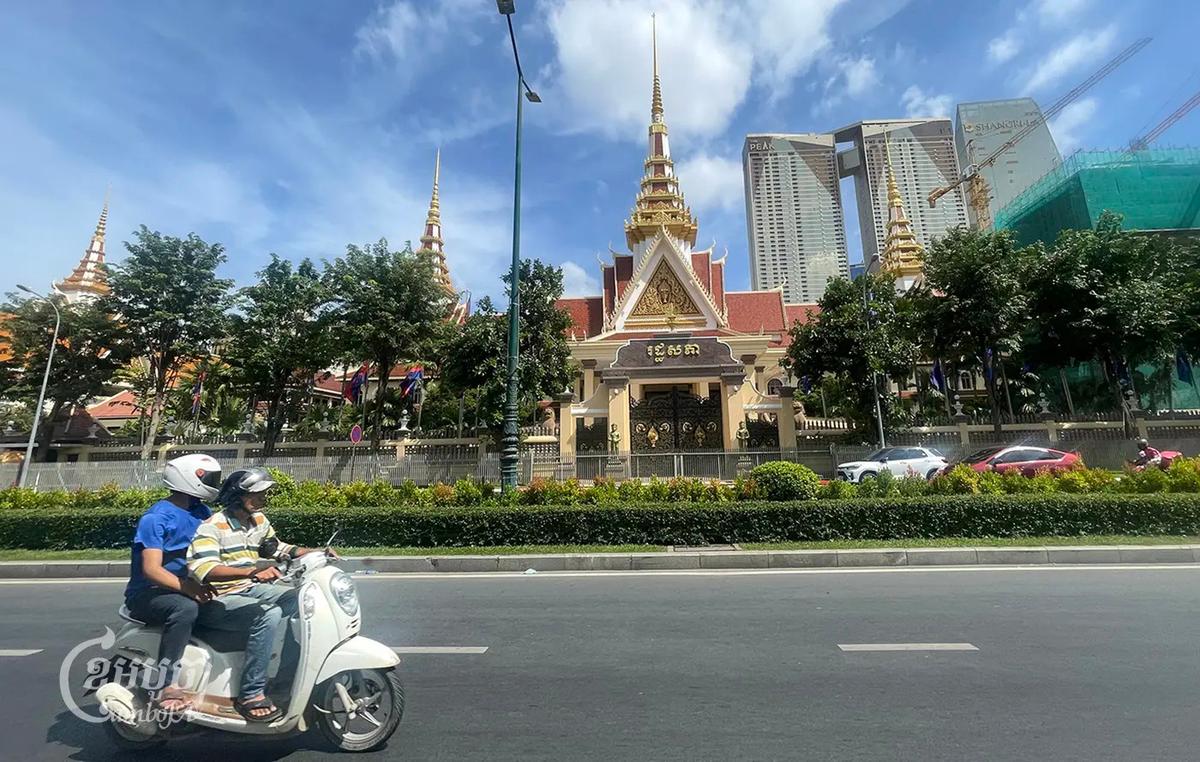 Motorists-drive-past-the-National-Assembly-in-Phnom-Penh-on-November-22_