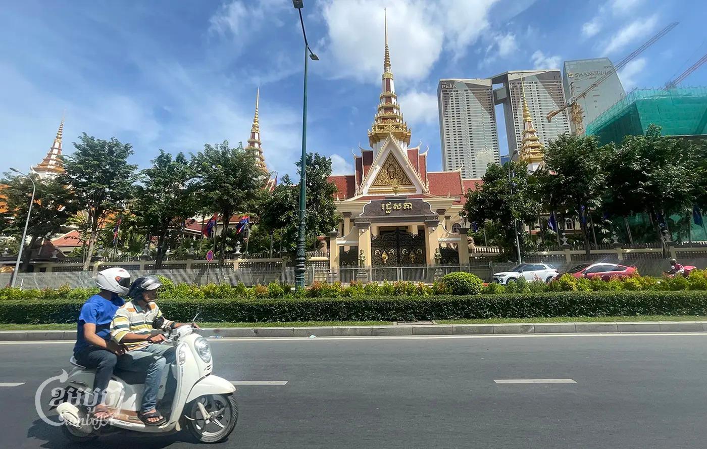 Motorists-drive-past-the-National-Assembly-in-Phnom-Penh-on-November-22_