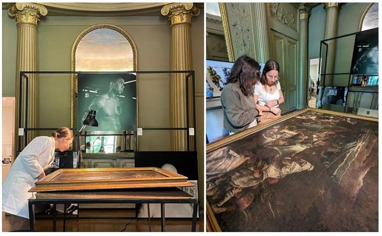 des jeunes travaillent sur la restauration d'un grand tableau