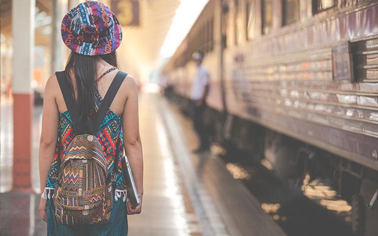 tourists-travel-train-station-by-jcomp-Freepik