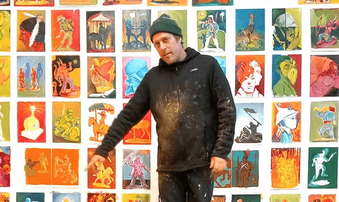 l'artiste baptiste laurent devant son oeuvre à l'institut francais de Madrid