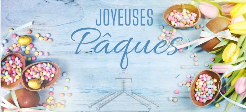 Des oeufs de Pâques, un église avec les mots Joyeuses Pâques