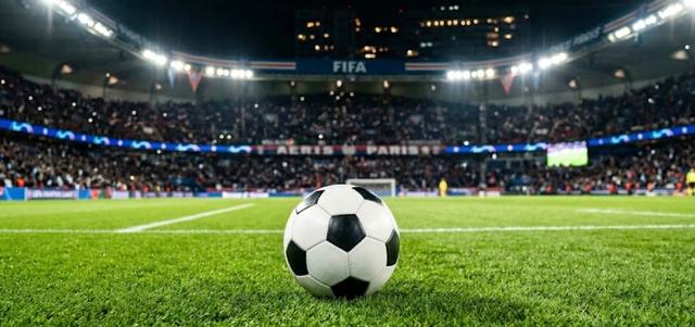 Un ballon de football sur un stade éclairé représentant les matchs FIFA 2026