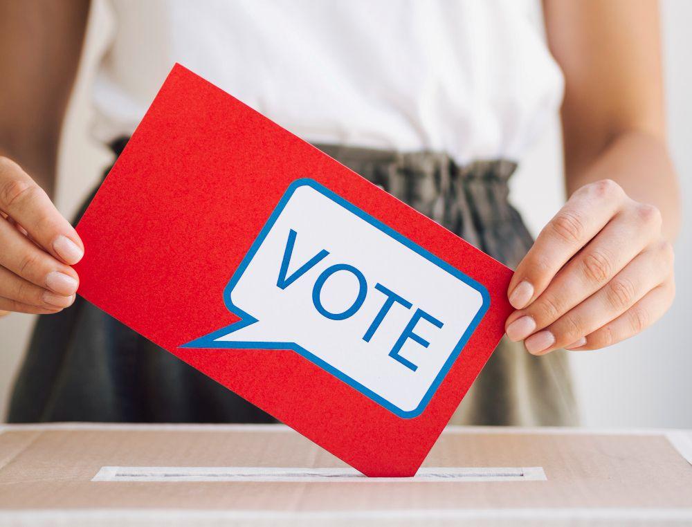 front-view-woman-putting-voting-message-box