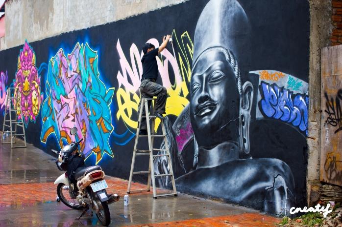 Phnom 1of1 Spraying his Vishnu mural