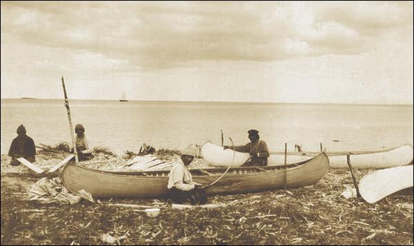 Innu_making_canoes_near_Sheshatshiu%2C_ca._1920