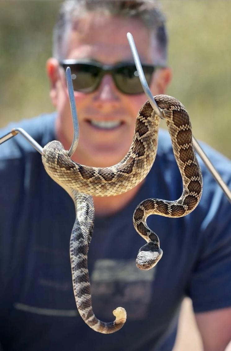 Bruce Ireland with a rattle snake