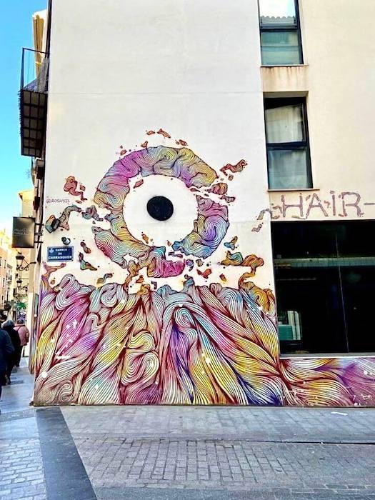 un oeil peint sur un mur à Valencia par le street artiste rosh333