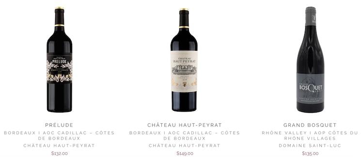 trois bouteilles de vin rouge