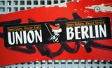 Stickers de l'Union Berlin sur un mur