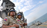 US_Navy_110227-N-9950J-210_Royal_Cambodian_Navy_officers_observe_flight_quarters_during_a_ship_tour_aboard_the_forward-deployed_amphibious_assault
