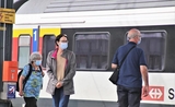Des Allemands avec un masque dans le train