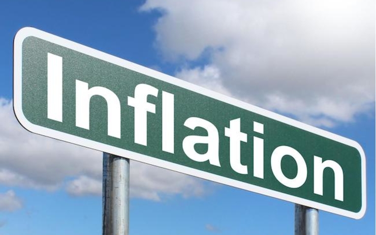 Un panneau sur lequel est écrit le mot inflation